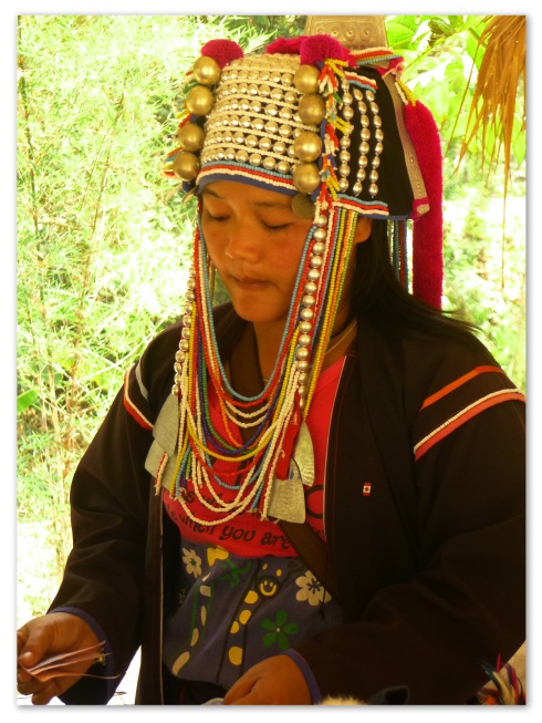 An Akha selling hand-crafted souvenirs.