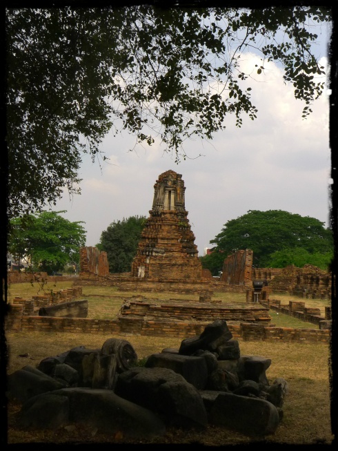 One of the satellite viharas. The blackened pieces of rubble were once figures of Buddha.